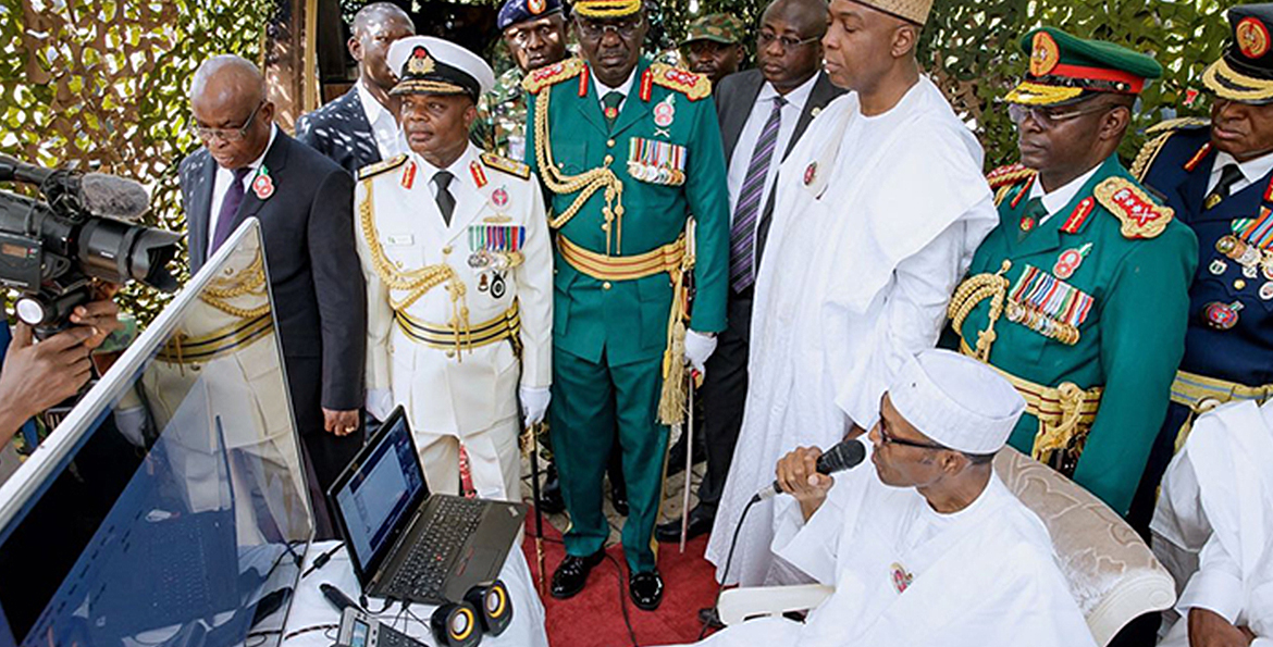 President Buhari speaks with Nigerian troops in Sambisa forest via NigComSat-1R
